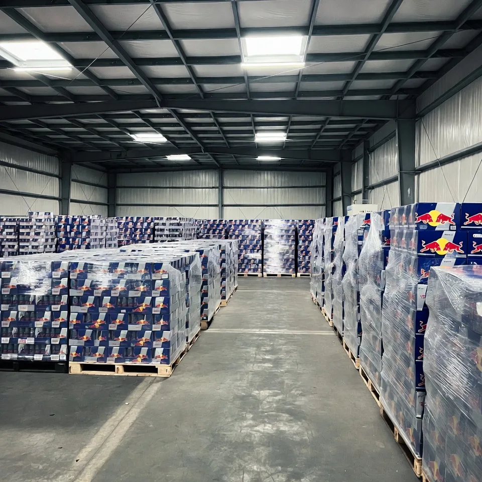 Wholesale energy drink pallet and container shipment preparation at Woove GmbH warehouse in Stuttgart, Germany